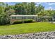 Inviting two-story home with lush green lawn, a carport, and a cozy front entrance at 3269 Tolley St, Claremont, NC 28610