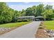 Charming home with well-manicured front yard, driveway, and covered parking at 3269 Tolley St, Claremont, NC 28610