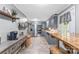 Modern kitchen with stainless steel appliances, gray cabinets, and eat-in dining area at 3269 Tolley St, Claremont, NC 28610