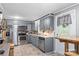 Updated kitchen with stainless steel appliances, gray cabinets, and a bright, airy feel at 3269 Tolley St, Claremont, NC 28610