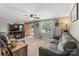 Comfortable living room featuring a cozy fireplace, plush sofas, and natural lighting at 3269 Tolley St, Claremont, NC 28610