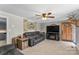Cozy living room with plush sofa, fireplace, and rustic décor for a relaxing atmosphere at 3269 Tolley St, Claremont, NC 28610