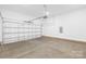Clean, bright garage featuring ample space, a durable concrete floor, and a modern garage door at 332 Hollingswood Dr, Statesville, NC 28625