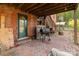 Backyard brick patio featuring a backyard grill and wooden staircase at 335 Summit Se Ct, Concord, NC 28025