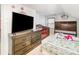 Bedroom with a wooden dresser, a crib, and a bed at 335 Summit Se Ct, Concord, NC 28025