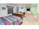 Bedroom with a wooden bed frame, a window with blinds, and a desk at 335 Summit Se Ct, Concord, NC 28025