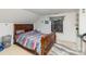 Bedroom with a wooden bed frame, a window with blinds at 335 Summit Se Ct, Concord, NC 28025