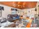 Bright living room featuring hardwood floors, a stylish couch, and stairs at 335 Summit Se Ct, Concord, NC 28025