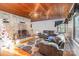 Inviting living room featuring hardwood floors, a stone fireplace, and cozy gray couches at 335 Summit Se Ct, Concord, NC 28025