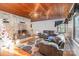 Inviting living room featuring hardwood floors, a stone fireplace, and cozy gray couches at 335 Summit Se Ct, Concord, NC 28025