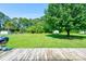 Spacious backyard with mature trees, shed, and green grass at 3413 Fallston Rd, Shelby, NC 28150