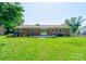 Backyard view of a home with a brick exterior and a wood deck at 3413 Fallston Rd, Shelby, NC 28150