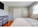 A tidy bedroom offers a comfortable bed, closet doors, and a dresser for storage, creating a relaxing atmosphere at 3413 Fallston Rd, Shelby, NC 28150