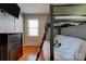 This charming bedroom includes a bunk bed with ladder, a dresser, a closet, and a window for natural light at 3413 Fallston Rd, Shelby, NC 28150