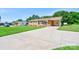 Brick home with an expansive driveway and well-manicured lawn at 3413 Fallston Rd, Shelby, NC 28150