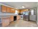 Functional kitchen featuring wood cabinets and modern stainless steel refrigerator at 3413 Fallston Rd, Shelby, NC 28150