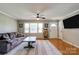 Cozy living room with hardwood floors, ceiling fan, and natural light at 3413 Fallston Rd, Shelby, NC 28150