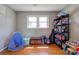 Spacious playroom with hardwood floors, a window for natural light, and storage for toys and activities at 3413 Fallston Rd, Shelby, NC 28150