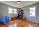 Spacious playroom with hardwood floors, a window for natural light, and storage for toys and activities at 3413 Fallston Rd, Shelby, NC 28150
