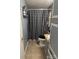 Small bathroom with checkered shower curtain and a narrow vanity at 456 Cornelius Rd, Mooresville, NC 28117