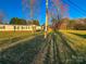 Front yard view showcasing home with a front porch and a spacious lawn at 456 Cornelius Rd, Mooresville, NC 28117
