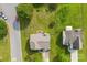 Aerial view showcases a well-kept lawn, fenced backyard, and brick patio in a residential area at 4612 Maple Crest Pl, Harrisburg, NC 28075