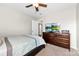 Cozy bedroom with a ceiling fan and a large dresser at 4612 Maple Crest Pl, Harrisburg, NC 28075