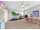 Spacious bonus room with pink desks and school decor at 4612 Maple Crest Pl, Harrisburg, NC 28075
