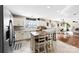 Bright kitchen with white cabinets, stainless steel appliances, and a functional center island at 4612 Maple Crest Pl, Harrisburg, NC 28075