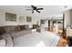 Bright and airy living room with hardwood floors, neutral colors, and comfortable seating at 4612 Maple Crest Pl, Harrisburg, NC 28075
