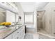 Elegant main bathroom featuring a soaking tub, glass shower, and double sink vanity at 4612 Maple Crest Pl, Harrisburg, NC 28075