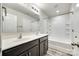 Bathroom featuring double sinks, a large mirror, and a shower-tub combo at 463 W Barr St, Lancaster, SC 29720