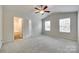 Spacious bedroom with a ceiling fan, ensuite bathroom, and a walk-in closet at 463 W Barr St, Lancaster, SC 29720