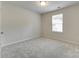 Neutral bedroom with soft carpet, ample natural light, and white walls at 463 W Barr St, Lancaster, SC 29720