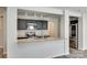 Modern kitchen featuring dark cabinets, granite countertops, stainless steel appliances, and stylish fixtures at 463 W Barr St, Lancaster, SC 29720