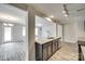 Modern kitchen featuring stainless steel appliances, granite countertops, and wood-look floors at 463 W Barr St, Lancaster, SC 29720
