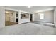 Open-concept living area flowing into a modern kitchen, perfect for entertaining with lots of natural light at 463 W Barr St, Lancaster, SC 29720