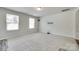 Bright and airy living room featuring neutral walls, plush carpeting, and large windows, ready for your personal touch at 463 W Barr St, Lancaster, SC 29720