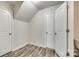 Spacious storage area with wood-look floors, white walls, and multiple access doors at 463 W Barr St, Lancaster, SC 29720