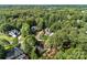 Discover a charming neighborhood surrounded by lush greenery and mature trees in this serene aerial shot at 5310 Addington Ct, Charlotte, NC 28277