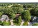 An aerial shot of the house with beautiful landscaping and mature trees that provide plenty of privacy at 5310 Addington Ct, Charlotte, NC 28277