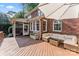 Spacious wooden deck with outdoor seating and brick house exterior at 5310 Addington Ct, Charlotte, NC 28277