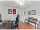 Bright bedroom with wood floors, a ceiling fan, and a well-lit room with natural light at 5310 Addington Ct, Charlotte, NC 28277