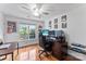 Bright bedroom with wood floors, a ceiling fan, and a large window bringing in natural light at 5310 Addington Ct, Charlotte, NC 28277