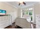 Cozy bedroom with a large window for natural light, a dresser, and hardwood floors at 5310 Addington Ct, Charlotte, NC 28277