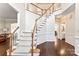 Elegant foyer with a staircase featuring hardwood floors and beautiful trim at 5310 Addington Ct, Charlotte, NC 28277