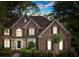 Charming brick two-story home featuring a well-manicured lawn and classic architectural details at 5310 Addington Ct, Charlotte, NC 28277