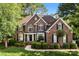 Charming brick two-story home featuring a well-manicured lawn and classic architectural details at 5310 Addington Ct, Charlotte, NC 28277
