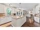 Bright and spacious kitchen with granite counters, white cabinets, and an inviting island at 5310 Addington Ct, Charlotte, NC 28277