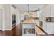 Gourmet kitchen with stainless steel appliances, granite countertops, island, and hardwood floors at 5310 Addington Ct, Charlotte, NC 28277